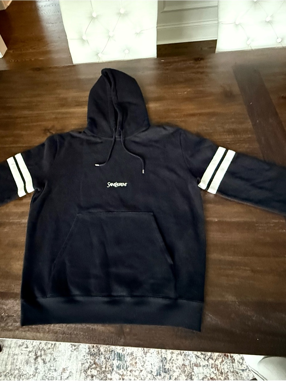 Saint Laurent Women’s Black Hooded Sweatshirt with White Sleeve Stripes.